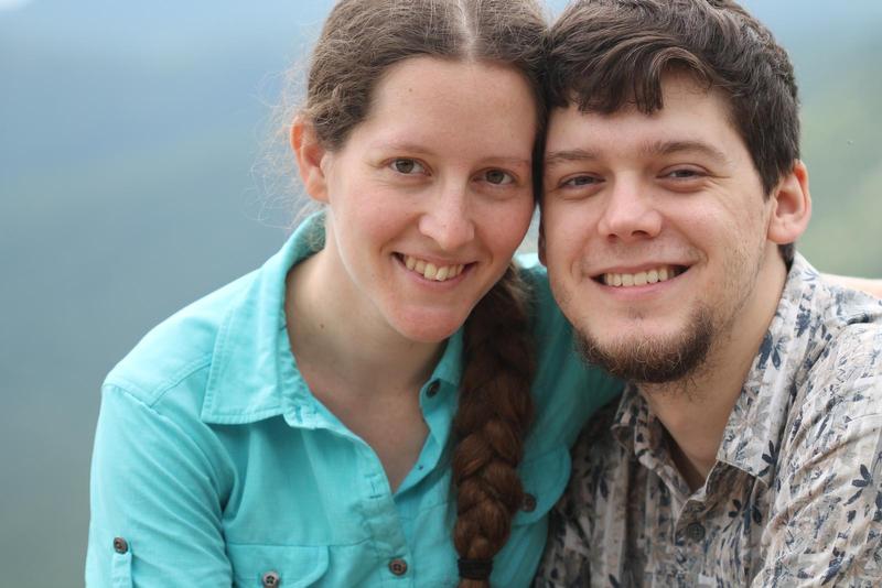 Jacqueline and Randy leaning their heads together smiling at the camera