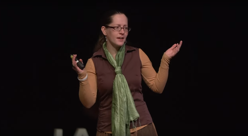 Jacqueline speaking and gesturing during TEDx Couer d'Alene 2020