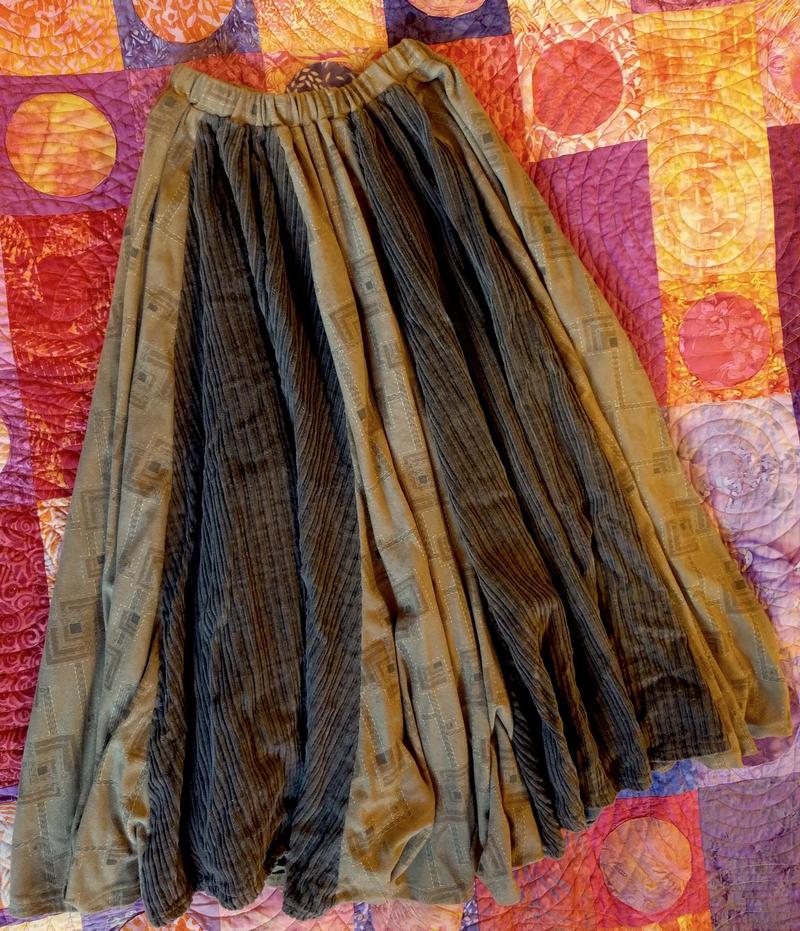 brown skirt lying on a bed