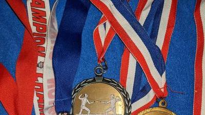 gold, silver, and bronze medals Jacqueline won at fencing tournaments