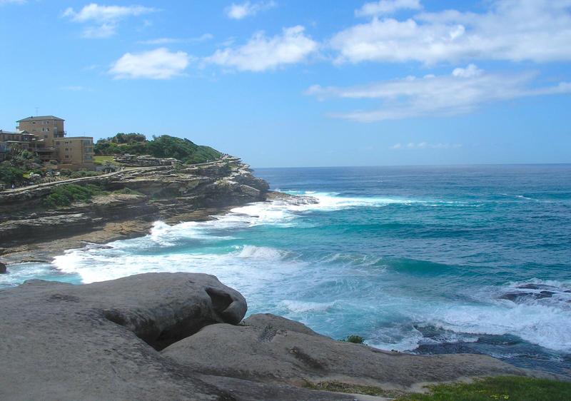 blue water sprays on the rocky coast between Bondi and Coogee beaches 