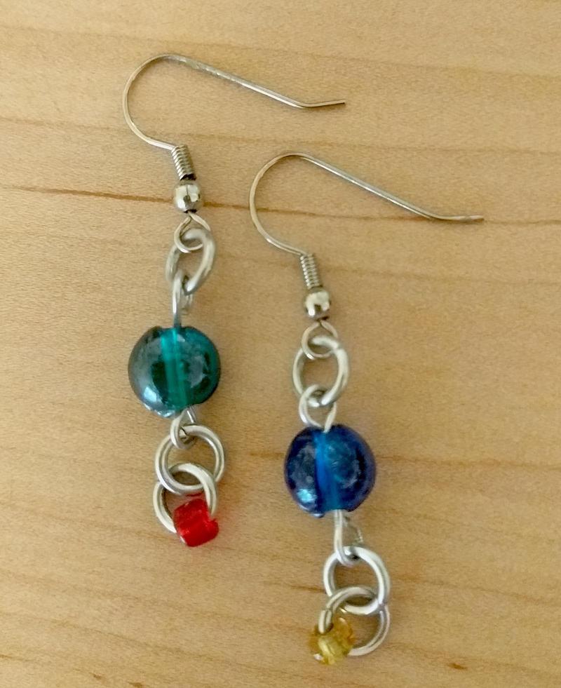 a pair of dangly earrings