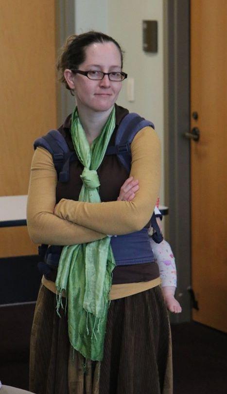 Jacqueline stands smiling with arms folded at TEDx Couer d'Alene 2020