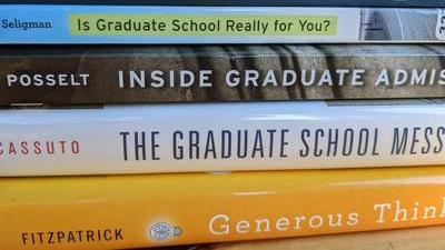 a stack of books about graduate school