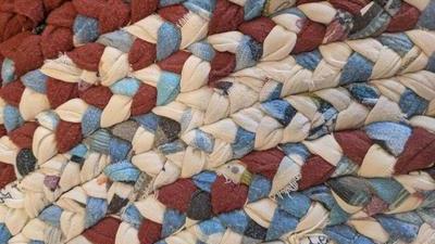 close up of braided flannel rag rug