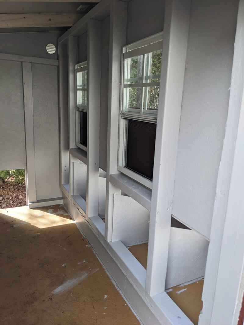 interior of a chicken coop painted gray