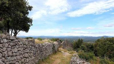 dry stone wall along a grassy path in the countryside