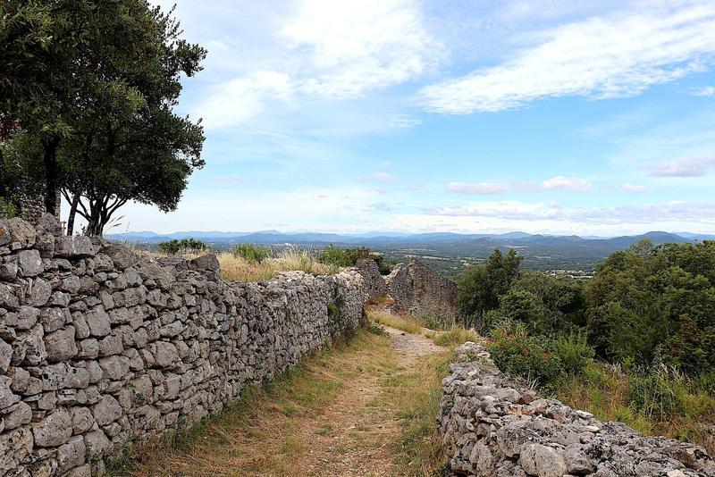 dry stone wall along a grassy path in the countryside