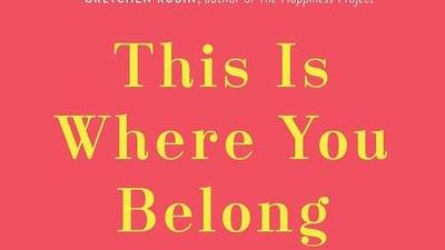 book cover of This Is Where You Belong by Melody Warnick featuring yellow and white text on a red background with line drawings of houses in the between