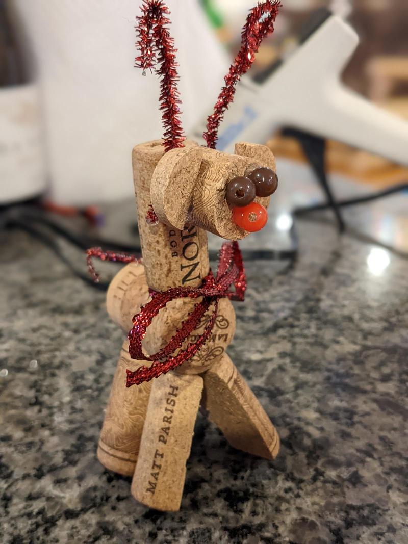 a reindeer made from corks with beads glued on for eyes and a nose, and little pipe cleaner antlers