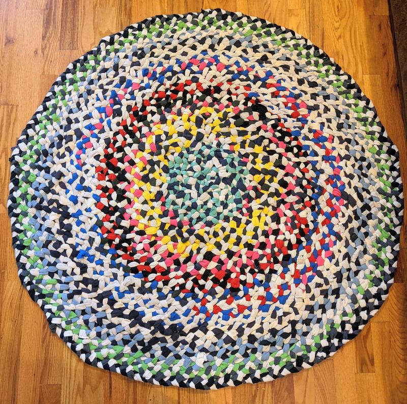 round braided rag rug made from tshirt strips, about three feet across